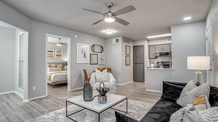 the living room has a ceiling fan and a couch at The Westley